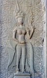 In 1927, Sappho Marchal, the 23-year-old daughter of Henri Marchal who was over­seeing restoration of monuments at Angkor Wat at the time, published a book on the hair­styles, clothes and jewelry of 1,737 images of various apsara she had recorded on the walls and columns of Angkor Wat. It remains probably the most complete account of the many apsara, thevada and other celestial females at Angkor Wat to the present day.<br/><br/>

Only one of the 1,737 apsara is smiling and showing her teeth. She is located on the inner side of the west portico, just south of the gopuram, almost concealed behind the gateway. It is now generally accepted that many of the apsara represented or were otherwise based upon real women of the Angkor court, but the reason for the - slightly bizarre - toothy grin remains a mystery.<br/><br/>


Perhaps one of the Angkor stonemasons was in the mood to create something different for a change, or perhaps he had a real earthly maiden in mind - or on his mind.<br/><br/>


Angkor Wat was built for King Suryavarman II (ruled 1113-50) in the early 12th century as his state temple and capital city. As the best-preserved temple at the Angkor site, it is the only one to have remained a significant religious centre since its foundation – first Hindu, dedicated to the god Vishnu, then Buddhist. It is the world's largest religious building. The temple is at the top of the high classical style of Khmer architecture. It has become a symbol of Cambodia, appearing on its national flag, and it is the country's prime attraction for visitors.<br/><br/>


Angkor Wat combines two basic plans of Khmer temple architecture: the temple mountain and the later galleried temple, based on early South Indian Hindu architecture. It is designed to represent Mount Meru, home of the devas in Hindu mythology: within a moat and an outer wall 3.6 kilometres (2.2 mi) long are three rectangular galleries, each raised above the next. At the centre of the temple stands a quincunx of towers.