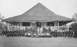 This photograph shows the Wedono of Banjaran (a region in present-day West Java near Bandung), in front of his house, with members of his entourage. In Dutch-administered Java, a wedono was a native regional administrator. The photograph was taken by the studio of Woodbury & Page, which was established in 1857 by the British photographers Walter Bentley Woodbury and James Page.