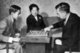 Informal picture of the Imperial family playing a board game (1950s). Crown Prince Akihito left, Empress Kojun centre, Emperor Hirohito right.<br/><br/>

Hirohito, the Shōwa Emperor ,(April 29, 1901 – January 7, 1989), was the 124th emperor of Japan according to the traditional order, reigning from December 25, 1926, until his death in 1989. Although better known outside of Japan by his personal name Hirohito, in Japan he is now referred to exclusively by his posthumous name Emperor Shōwa.<br/><br/> 

At the start of his reign, Japan was one of the great world powers and one of the five permanent members of the council of the League of Nations. Emperor Hirohito headed Japan's imperial expansion, militarization, and involvement in World War II. After the war, he was not prosecuted, but remained emperor, though with significantly reduced power.